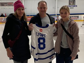 Lesley, Mark and Hannah Lyons accepted the North Stars jersey in memory of their 17-year-old son Jack Sunday at Pete Palangio Arena. Jack's hockey number has officially been retired.