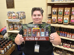 Shawna Harvey, owner and chef of Big Mama's Kitchen Creations, with her hot sauce sampler pack made up of six of her award-winning hot sauces, at her booth at the Artisans Holiday Show and Sale at the Harry Lumley Bayshore Community Centre in Owen Sound on Saturday, December 3, 2022.