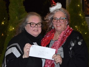 Susanna Almeida and Mary Jo Schottroff Snopko accepted a $2,000 grant from the Sunset Community Foundation on behalf of Grand Bend’s Jingle Bells Group, which helps spread holiday cheer by decorating the community and organizing events such as the Santa Claus Parade. Dan Rolph