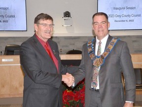 2023 Grey County Warden Brian Milne, right, is congratulated by Kevin Eccles, who was warden in 2008, 2009 and 2015 after he was presented with the chain of office during the inaugural session of the 2023 Grey County council at the Grey County administration building in Owen Sound on Tuesday, December 6, 2022.