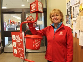 Brenda Dunn, co-ordinator of the Salvation Army kettle campaign in Sarnia, stands at the kettle in the entrance of the Metro store at Northgate.  The campaign has a goal of raising $160,000 in donations by Christmas Eve.  Paul Morden/Postmedia