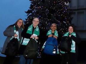 The Huntington University tree was officially lit for the season this week in support of the holiday hamper initiative, a yearly project undertaken by Réseau ACCESS Network. For the left are Mary-Liz Warwick, Kevin McCormick, Bela Ravi and Heidi Eisenhauer. Gino Donato photo