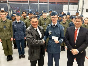 The Canadian Owners and Pilots Association Flight 203, based in Chatham-Kent, has donated $500 to the 294 Chatham-Kent Air Cadet Squadron. COPA president Pat Brady (left) and Kelvin Halbauer (left), organizer of the Discover Aviation program, present a $500 cheque to Squadron Warrant Officer Mark Debevc. Ellwood Shreve/Postmedia