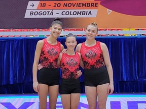 Sol Mendez, Gillian De Vries and Regan Forster of Salto Gymnastics in Sherwood Park won silver medals as part of Team Canada at the recent Pan-Ams in Colombia. Photo Supplied