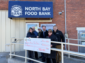 (Left to right)North Bay Food Bank executive director Debbie Marson, Rotarians Don Coutts, Jeff Celantano, Jeff Hobbs, Gisele Lynch,Jeff Rogerson donate $5,000 to the North Bay Food Bank.
