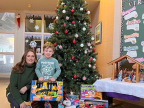 St. Gregory kindergarten teacher Alethea Sorel wth JK student Jasper Sands. Jasper is one of the many students at the school who have been bringing in toys and food for the local food bank as the school once again runs the St. Gregory Catholic Elementary School Advent Food and Toy Drive.