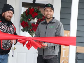 Brandon Pollari and Ward 2 Coun. Luke Dufour attend key ceremony at Affordable Home Ownership Program at 222 Brown St., in Sault Ste. Marie, Ont., on Tuesday, Dec. 13, 2022. (BRIAN KELLY/THE SAULT STAR/POSTMEDIA NETWORK)