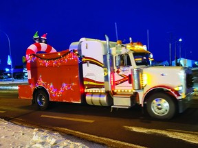 More than 60 trucks participated in the 3rd annual Leduc Country Christmas Convoy, December 10. The trucks departed from Blackjacks Roadhouse, paraded through Leduc, and arrived at the Leduc Country Lights, where drivers made toy donations to Leduc Santa's Helpers. (Dillon Giancola)