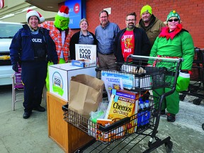 The 4th annual Stuff A Cruiser event from the Leduc RCMP raised $,1940, and 2,658 lbs of donations for the Leduc and District Food Bank. Donations were collected at Leduc Safeway, Craig's No Frills, and Leduc Co-op, on December 10. (Dillon Giancola/ supplied)