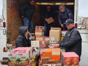 A group of agricultural businesses donated enough food for 200 Christmas dinners to Chatham Outreach for Hunger on Thursday.