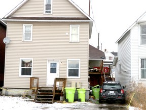 Police keep watch at the scene of a homicide at 240 Albert St. W., in Sault Ste. Marie, Ont., on Friday, Dec. 16, 2022. (BRIAN KELLY/THE SAULT STAR/POSTMEDIA NETWORK)