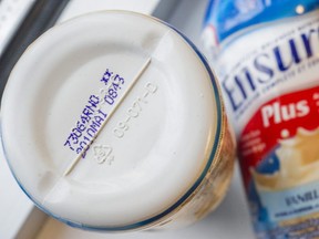 ABBOTSFORD, BC: November 12, 2015 -- Bottles of Ensure, a protein drink that was given to prisoner after his jaw was broken while in custody and relegated to a liquid diet. The product was several months past its best before date.  (Photo by Ric Ernst/ PNG)  (see story by city)  TRAX #: 00040137A [PNG Merlin Archive]