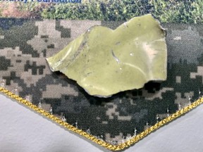 A piece of metal from a Russian SU-34 fighter jet that was shot down in the Kyiv region on March 18 2022. The piece of metal is up for sale. The Vest Project co-founders, Lori Burns and Cindie D’Agostino received the gift for their efforts to help frontline soldiers.