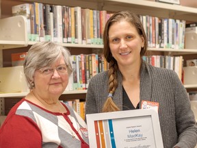 Margaret Christenson, left, president of the Friends of the Prince Township Library, presents volunteer librarian Helen Mackay with the Joyce Kasch Award for outstanding service.  Mackay hopes to introduce programs at the library that challenge young patrons to become fluent readers. Marguerite La Haye