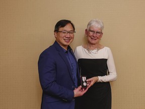 Lorraine Stewart (right) is presented Queen Elizabeth II's Platinum Jubilee Medal by Mayor William Choy of Stony Plain (left) for her significant volunteer contributions to the community during a ceremony at Best Western Stony Plain on Tuesday, Dec. 6, 2022. Photo courtesy of the Town of Stony Plain.