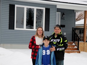 Marlee and Karl Wessel with their son, Lincoln, 9, at their restored home at 704 Shafer Ave., in Sault Ste. Marie, Ont., on Thursday, Dec. 22, 2022 (BRIAN KELLY/THE SAULT STAR/POSTMEDIA NETWORK)