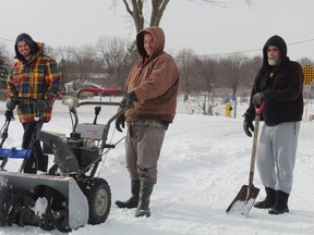 Mark Jasek, Austin Taylor and Bob Cuts were working together clearing their snowbound Brantford street on Saturday afternoon.