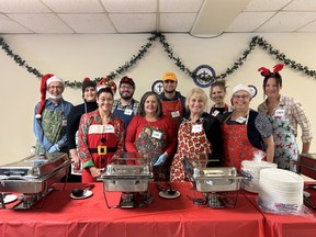 An army of volunteers served more than 700 plates of Christmas dinner to those in need or those who were spending the holidays alone in the lower hall of the Pro Cathedral of the Assumption on Christmas Day.