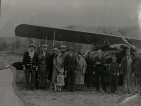 80.1144.001 – Peace River Airways – either an American Eagle or WACO aircraft, at Shaftesbury Trail River Lot 34 airstrip ca. 1930. Peace River Airways provided flight service to the area for at least a decade from 1930. Among people pictured: Martin McNamara, Ged Barker, Mr., and Mrs. Dave Steedsman, Larry Champagne, Marguerite (Mrs. Max) Zabel, and son Mark. It is suggested Stan Warren “is almost certainly one of the aviators”, as he once owned the plane.