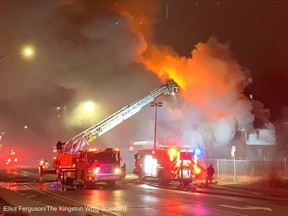 Kingston Fire and Rescue firefighters at the scene of a building fire at Princess Street and Alfred Street in Kingston on Tuesday night.