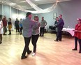 Dance Instructor and world champion dance professional, Dale Tosczak, and assistant Jeanne Kalyn, demonstrate the two-step to participants.