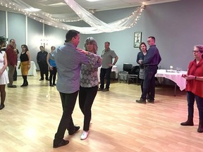 Dance Instructor and world champion dance professional, Dale Tosczak, and assistant Jeanne Kalyn, demonstrate the two-step to participants.