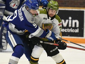 Pasquale Zito of the North Bay Battalion competes with Alex Assadourian of the visiting Sudbury Wolves in Ontario Hockey League play Wednesday night. The Troops visit Sudbury on Friday night.