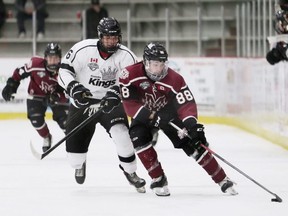 Chatham Maroons' Tyler Trealout (88) protects the puck from Komoka Kings' Carter Lawrence (6) in the third period at Chatham Memorial Arena in Chatham, Ont., on Sunday, Dec. 18, 2022. Mark Malone/Chatham Daily News/Postmedia Network