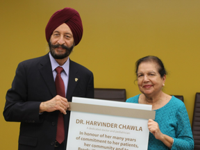 Local pediatrician, Dr. Harvinder Chawla, right, and her husband, Jag Chawla, are pictured as they admire the dedication plaque that was presented to Dr. Chawla. The plaque was mounted in Brockville General Hospital’s Women and Children's Program to honour Dr. Chawla's 47 years of work at the hospital.