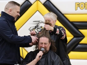 Dan Tulk gets shaved bald at Fort McMurray Composite School after $13,000 was raised for local charities on December 15, 2022. Photo by Momin Syed?FMPSD