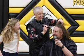Dan Tulk is shaved bald at Fort McMurray Composite School after $13,000 was raised for local charities on December 15, 2022. Photo by Momin Syed/FMPSD