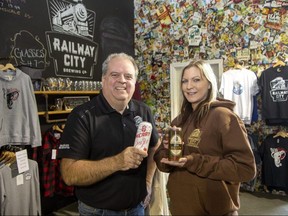Paul Corriveau, Railway City Brewing Co. vice-president of sales and marketing, and lead brewer Amanda Fehr have been in a celebratory mood since the St. Thomas company was acquired by a Toronto-based adult beverage company. Photograph taken Wednesday, Dec. 14, 2022. (Derek Ruttan/The London Free Press)