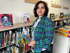Luda Repenko, who is from Ukraine, works as a Senior Page at the library.