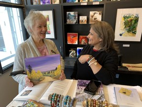Artists Robbin Pulver-Andrews, who works in acrylic and encaustic art (which uses hot beeswax), and Sue Hammond, of SK Hammond Art, who creates paintings, cards and semi-precious bracelets, were just two of the artistic vendors at Lynnwood's Holiday Market on Saturday.