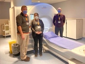 Medical radiation technologists, left to right, Matt Fry, Baileigh D’Angelo and Matt Savage with the MRI currently used in Owen Sound hospital. Grey Bruce Health Services just got funding to operate a second unit just like it. (GBHS photo)