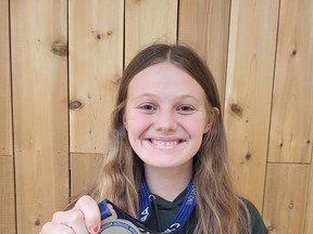 Nicholson Crusaders player and Tyendinaga Mohawk Territory resident Evelyn Shakell shows off her silver medal, which she won at the Ontario Federation of School Athletic Associations girls basketball championships recently. (Jan Murphy/Local Journalism Initiative Reporter)