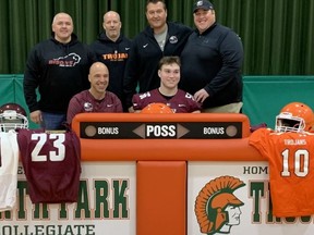 North Park Collegiate's Quin Cassidy (seated, right) recently committed to attend McMaster University. With him are McMaster head coach Stefan Ptaszek (seated, left), Brantford Bisons varsity head coach Jason Nagy (back, left), NPC head coach Todd Andrew and McMaster offensive line coaches Kelly Ireland and Chris Hopkins. Submitted