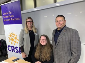 Carrie Sanders (left), professor of criminology at Wilfrid Laurier University, Samantha Henderson, project co-ordinator for Laurier's Centre for Research on Security Practices, and Brantford Police Chief Rob Davis attend the official launch this week of the Laurier Hub for Community Solutions at the university's Brantford campus. Vincent Ball