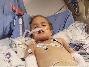 Four-year-old Remy Rutherford of Simcoe, Ontario lies in the paediatric ICU at Kingston Health Sciences Centre. The youngster was airlifted to Kingston after children's hospitals in Hamilton and London had no beds available. Stephanie Rutherford photo