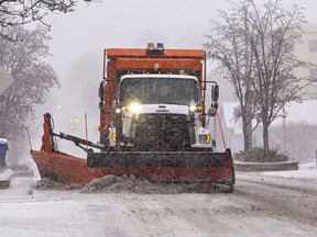 A City of Brantford plow clears snow on Dalhousie Street in downtown Brantford, Ontario on Friday morning December 23, 2022. Brian Thompson/Brantford Expositor/Postmedia Network