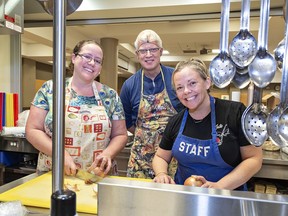 Soup for the Soul program manager Jeanine Van Hout (left) with volunteers Dave Hook, and Kate McGinnis prepare a meal at St. Andrews United Church in Brantford.