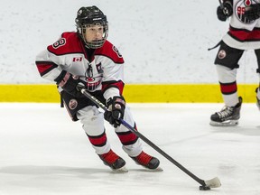 Ryder Summers of the Brantford 99ers looks to pass the puck during a Under-13A game against the Waterloo Wolves on Tuesday December 27, at the Gretzky Tournament in Brantford.