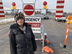 Haldimand Mayor Shelley Bentley addreses a news conference on Wednesday in front of police cruisers guarding the scene near Hagersville where an OPP officer was shot and killed Tuesday. Vincent Ball