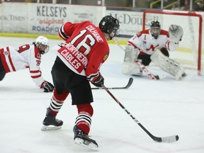 Brockville forward Lucas Culhane lines up what would prove to be the game-winner against Nepean goalie Luca Sandu as defenceman Nick Larkin tries to intervene during the first period of the Braves-Raiders game at the Memorial Centre on Friday night. Brockville went on to blank Nepean 5-0. Sami Molu made 34 saves to pick up the shutout for the Braves.
Tim Ruhnke/The Recorder and Times