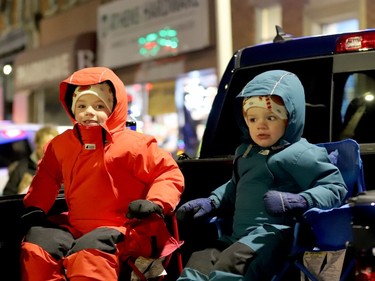 Noah Morrison, 5, of Jasper, left, and his brother Owen, 3, are bundled up against the December air as they await Santa Claus on Main Street, Athens. (RONALD ZAJAC/The Recorder and Times)