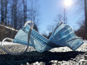 A discarded facemask lies on the ground on the northern stretch of the Brock Trail on Tuesday morning. (RONALD ZAJAC/The Recorder and Times)