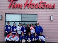 Brockville Winter Classic organizers pose outside Friday's event launch at the Brockville Parkedale Avenue Tim Hortons. In back, from left, are Pat Cooper, Kyle Atkins, Ken Sine, Ryan Billing, Natasha Avis and Shane Joyce of Tim Hortons, and Matt VanderBaaren. In front are Dan Thompson, Jeff Severson, Jess Barabash, Meghan Sample, Dave Erwin and Orlando Spicer. Missing from the photo are committee membersChris Hum and Joanne Sine. (SUBMITTED)