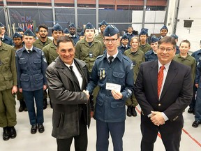 The Canadian Owners and Pilots Association Flight 203, based in Chatham-Kent, has donated $500 to the 294 Chatham-Kent Air Cadet Squadron.  This is just icing on the cake since the Discover Aviation program run by the local COPA group, which offers free airplane rides, has helped boost interest in the cadets.  COPA president Pat Brady, left, and Kelvin Halbauer, left, organizer of the Discover Aviation program, are seen there presenting a $500 check to Squadron Warrant Officer Mark Debevc.  PHOTO Ellwood Shreve/Chatham Daily News