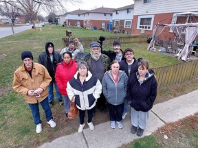 Several residents of apartments in four-plexes owned by Vanroboys Enteprises Ltd. are worried they could be evicted after receiving notices stating they must remove fences, shed, gazebos and even a swing set from around their units with seven days. Many of the residents seen here are on Ontario Disability Support Program pensions and fear the financial impact if they have to try to find a new apartment with the much higher rental rates in today's market. (Ellwood Shreve/Chatham Daily News)