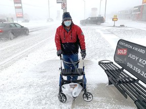 Gordon Clogg was waiting patiently at a transit stop on St. Clair Street in Chatham Friday morning as he withstood the frigid winds that accompanied the snow storm that hit the region.  PHOTO Ellwood Shreve/Chatham Daily News